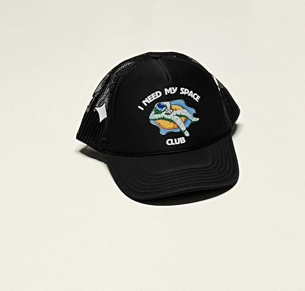 I need my space club day time trucker hat